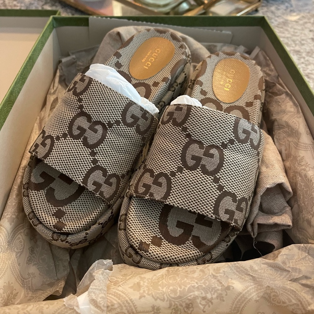 Women’s brown Gucci gg platform sandals